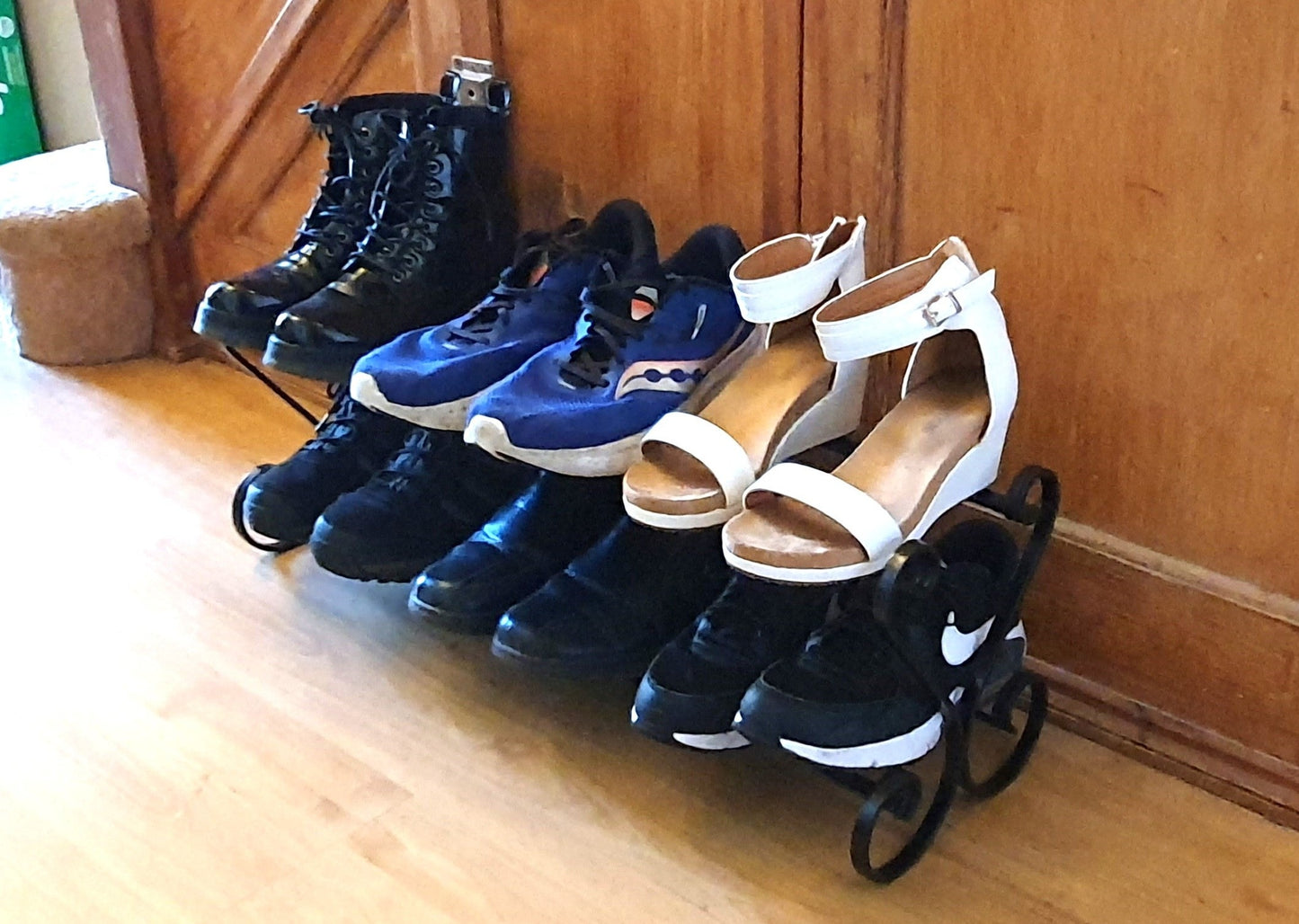 Wrought iron shoe rack. Open topped heart-shape. Handmade and crafted in the UK