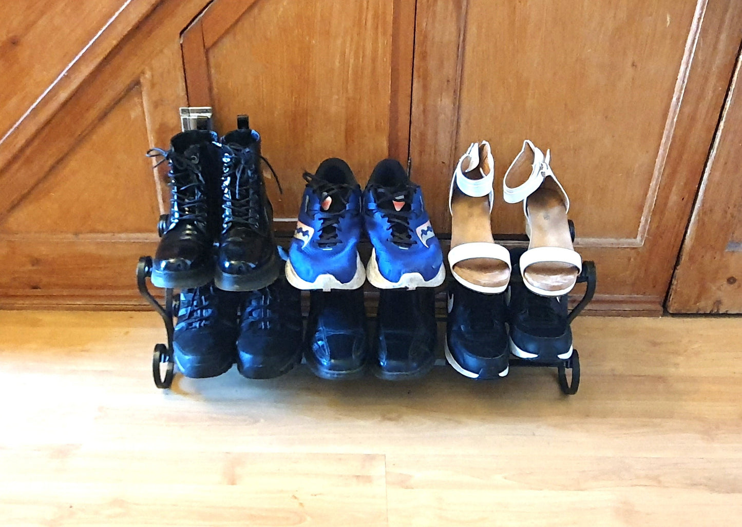 Wrought iron shoe rack. Open topped heart-shape. Handmade and crafted in the UK