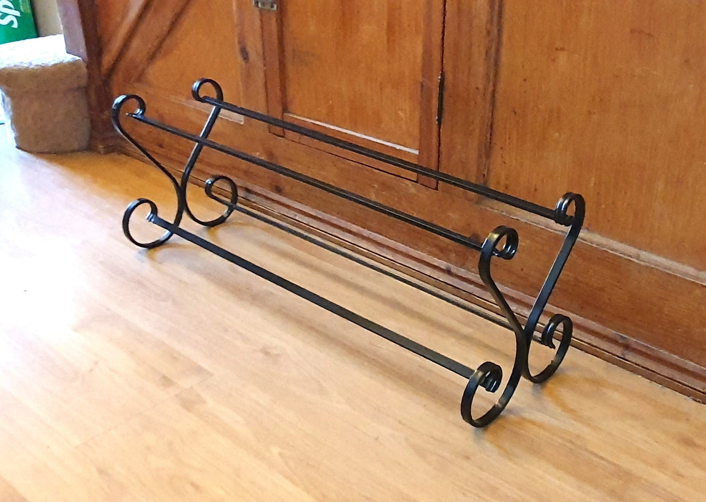 Wrought iron shoe rack. Open topped heart-shape. Handmade and crafted in the UK