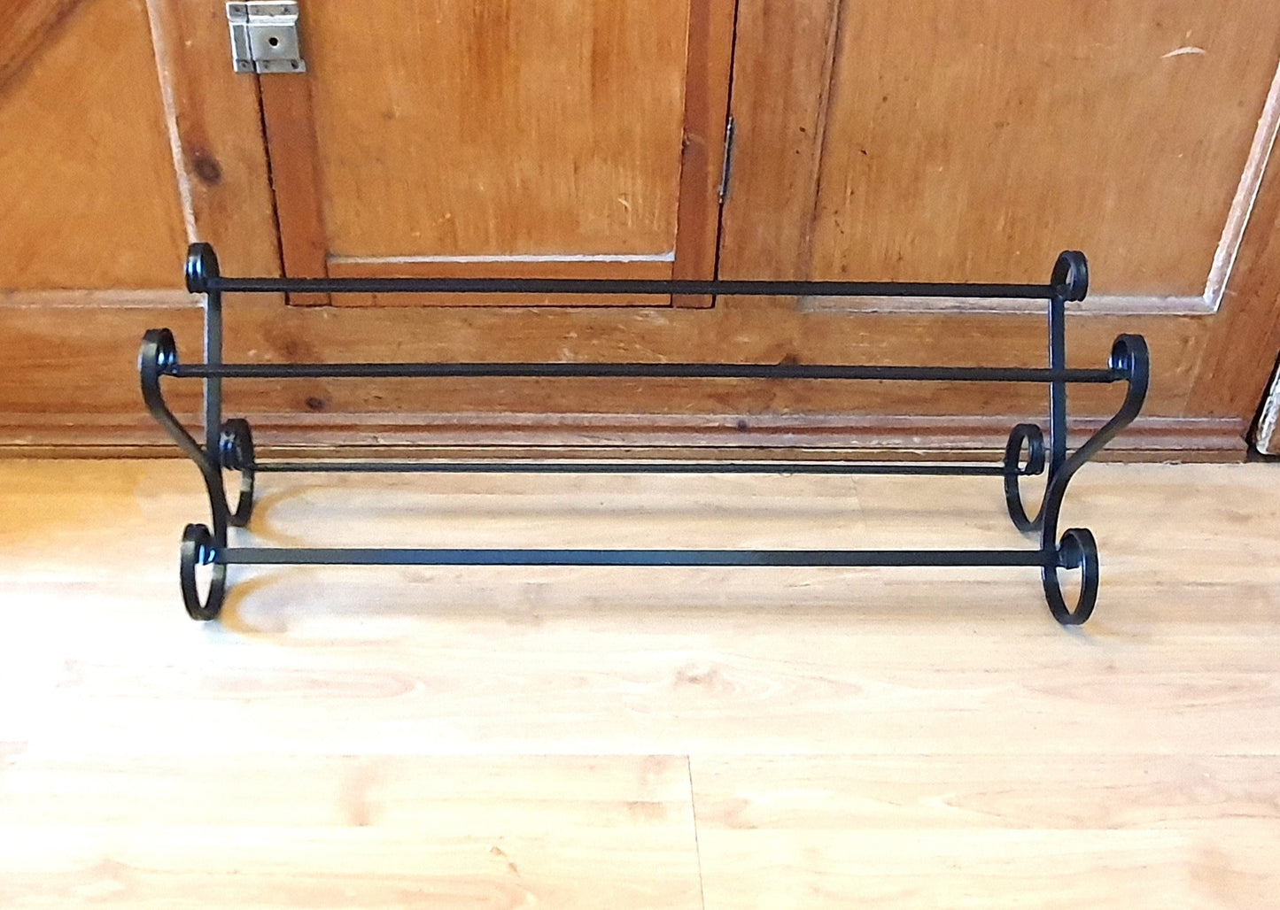 Wrought iron shoe rack. Open topped heart-shape. Handmade and crafted in the UK