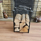 Traditional steel log store with twisted bar detailing. Handmade and crafted in the UK