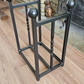 Traditional steel log store with twisted bar detailing. Handmade and crafted in the UK