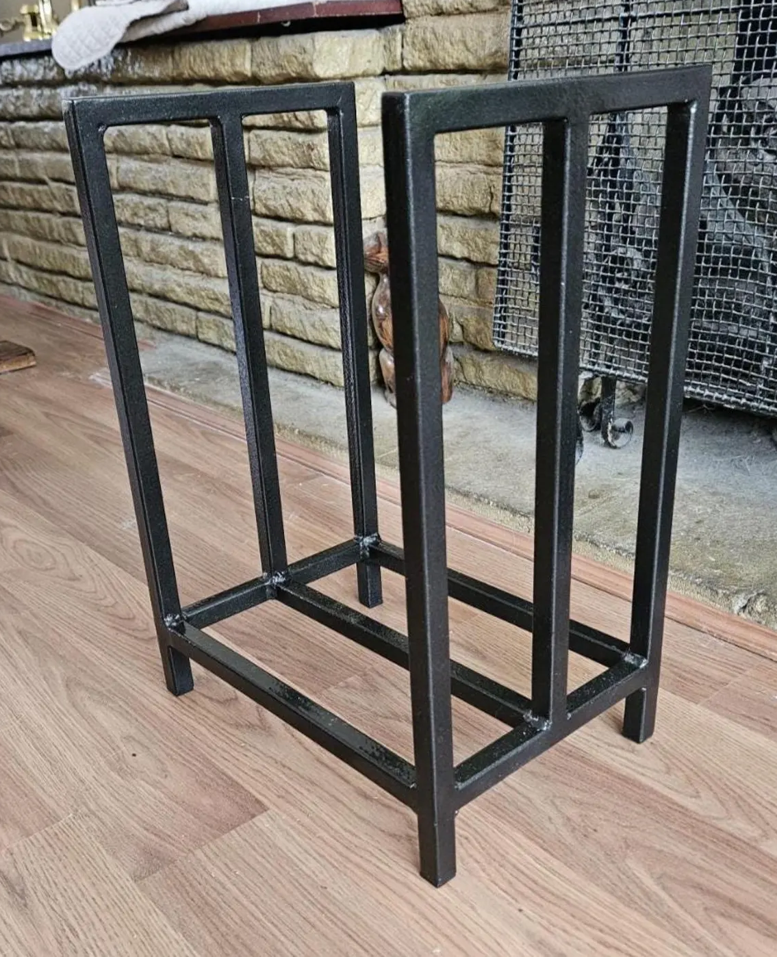 Minimalist steel log store. Handmade and crafted in the UK