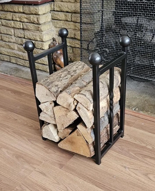 Traditional steel log store with twisted bar detailing. Handmade and crafted in the UK