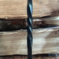 Traditional steel log store with twisted bar detailing. Handmade and crafted in the UK